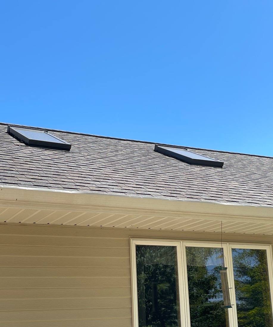 Skylights on a Pine Island roof photographed during an inspection, June 2022