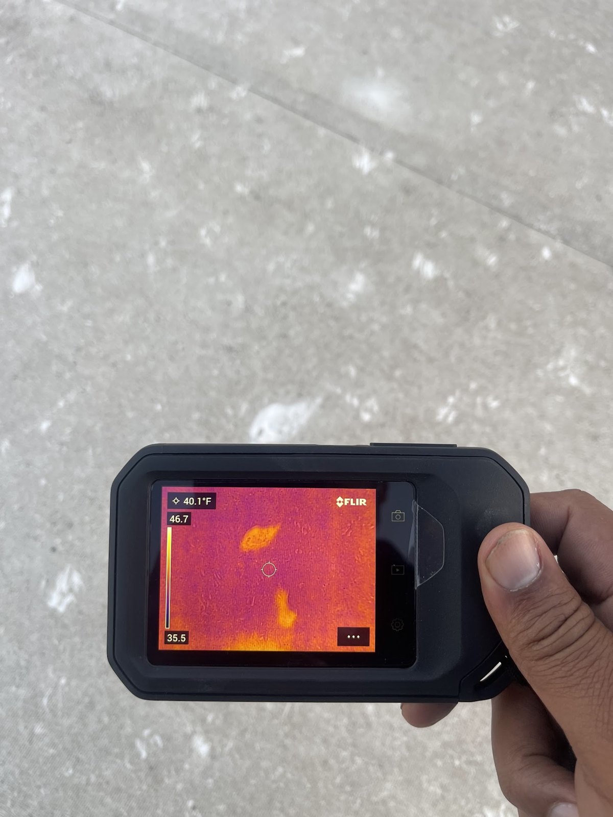 Repair King inspector using a thermal camera to trace hidden moisture
