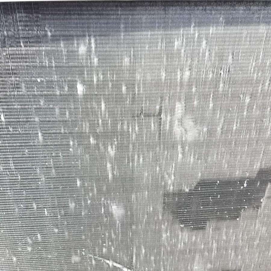 Marks across a rooftop condenser coil, measured during the West St. Paul inspection