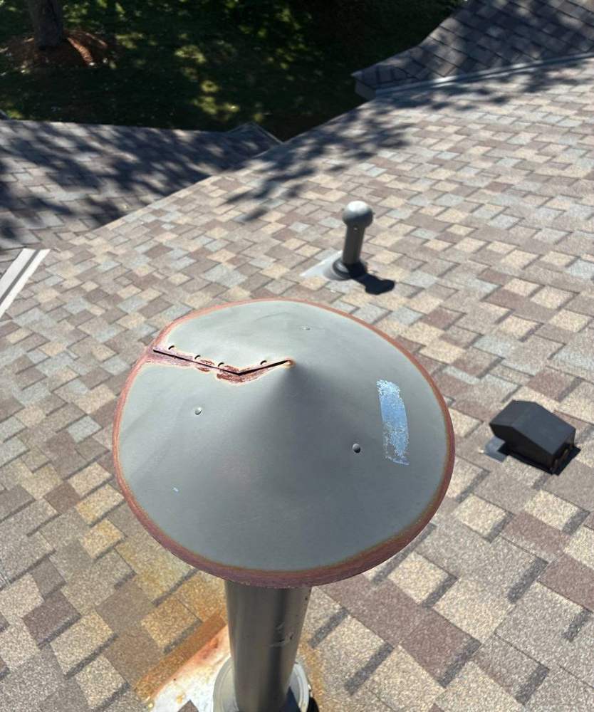 Rusted, hail-cracked roof vent boot found during a Chisago City inspection, June 2026