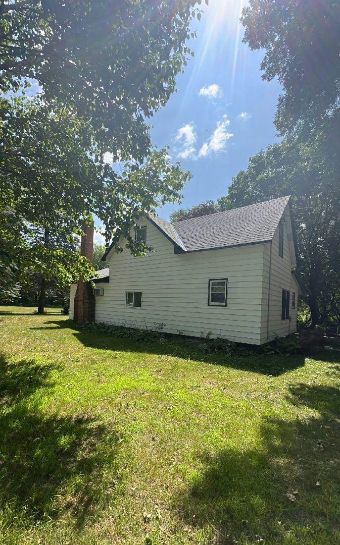Rental home near Dassel photographed during a roof inspection, July 2023