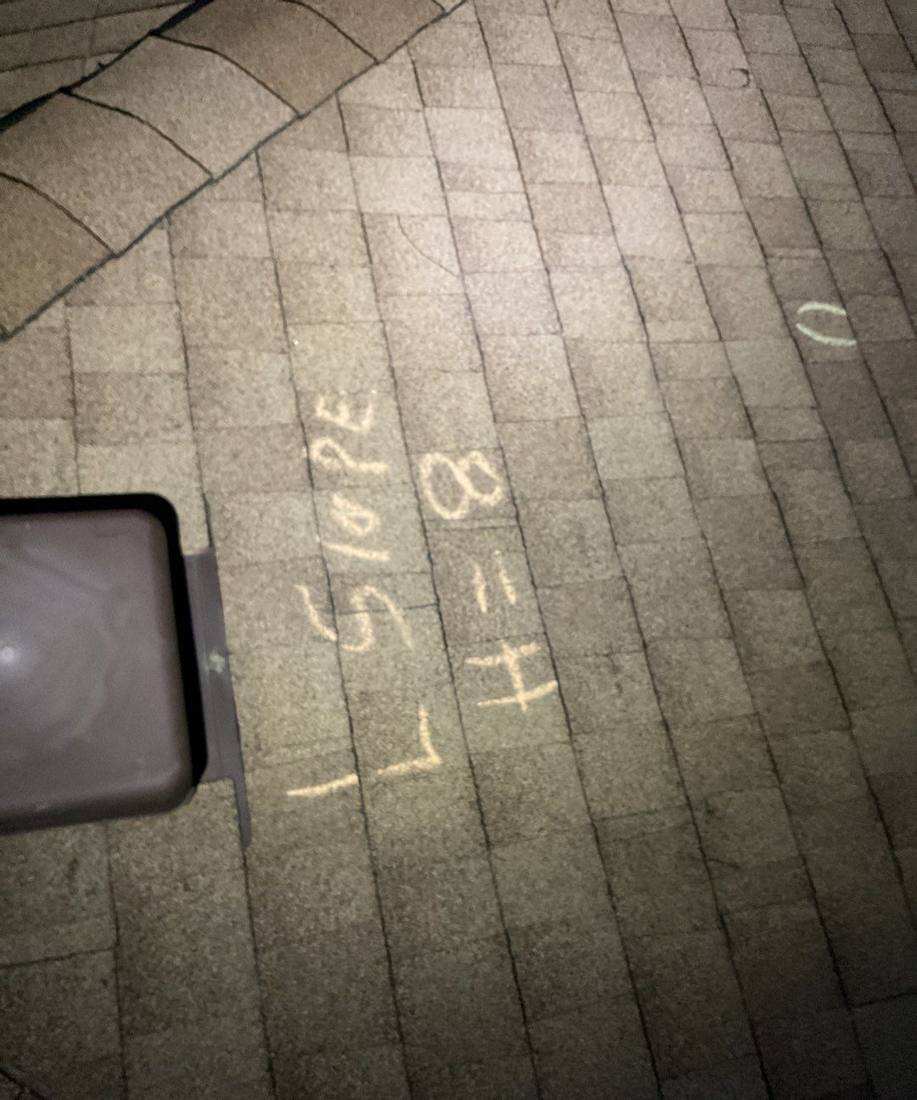 Chalk-marked hail hits and slope notes on a Maplewood roof, May 2023