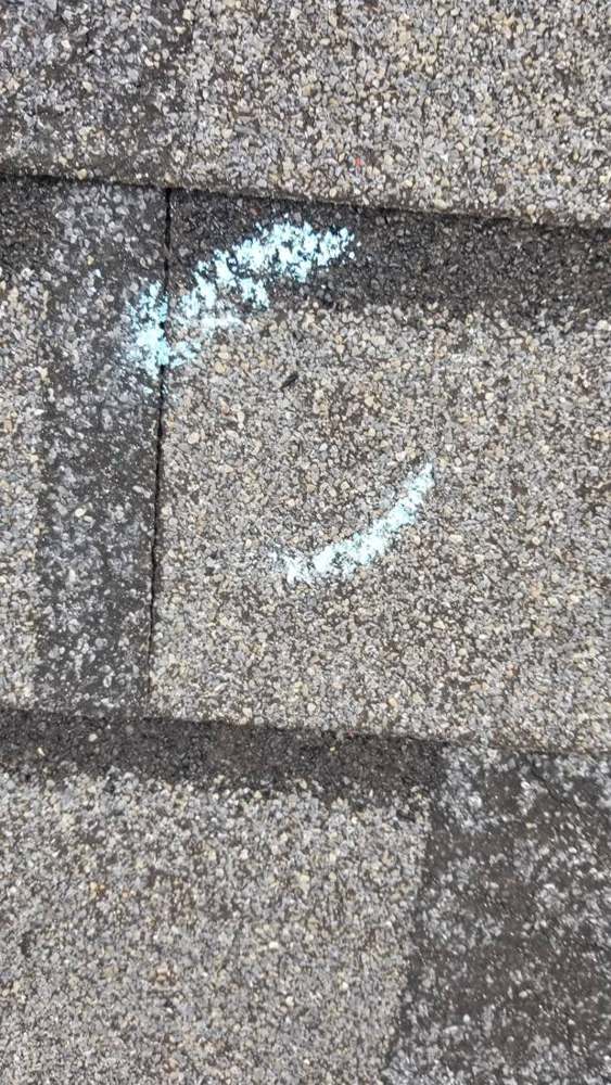 Chalk-circled hail hit on a Ramsey roof during our August 2018 inspection