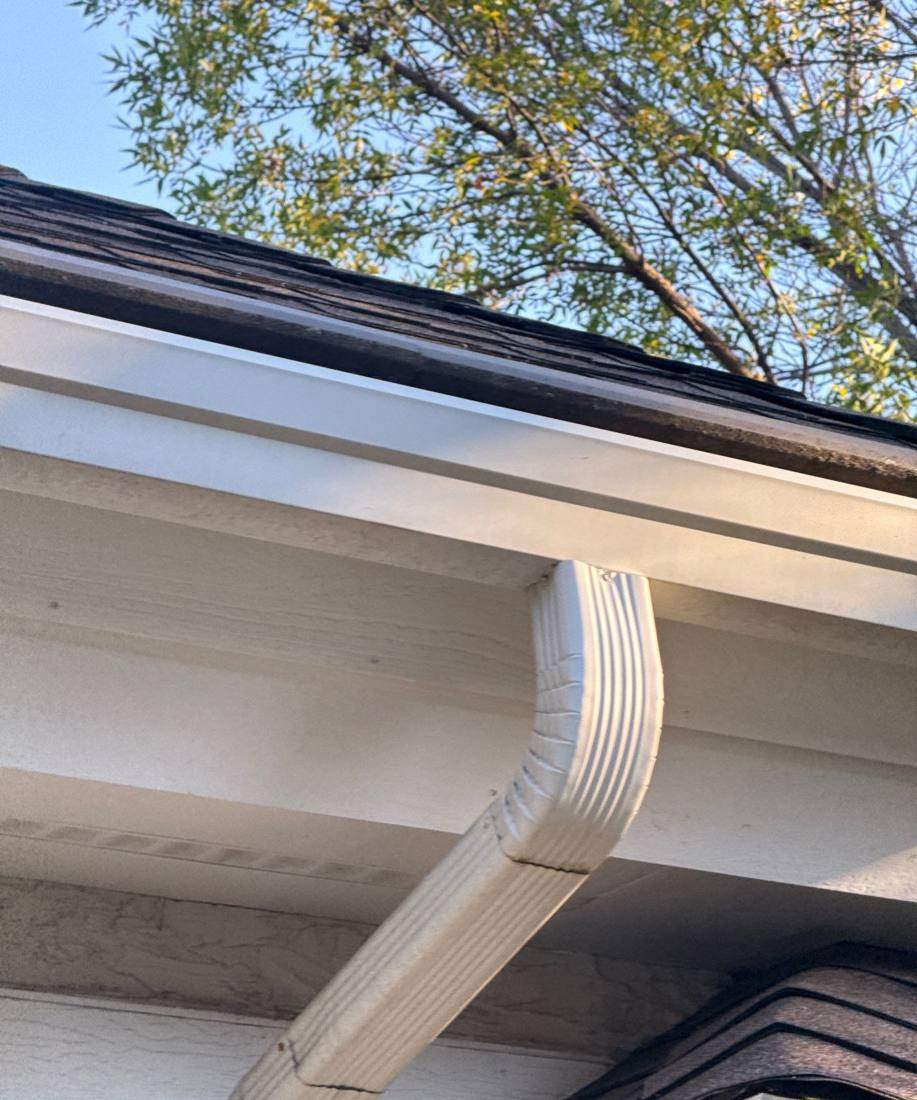 Downspout and gutter corner on a Burnsville home, October 2025