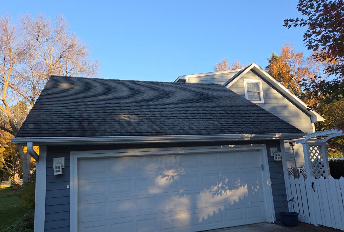 Attached garage and gable roof in New Brighton photographed during a roof inspection, October 2025