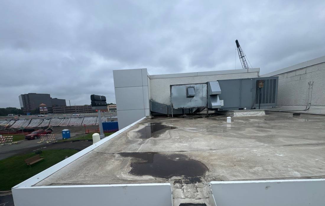 Flat commercial roof with rooftop units at the Bloomington Lincoln dealership, photographed by Repair King