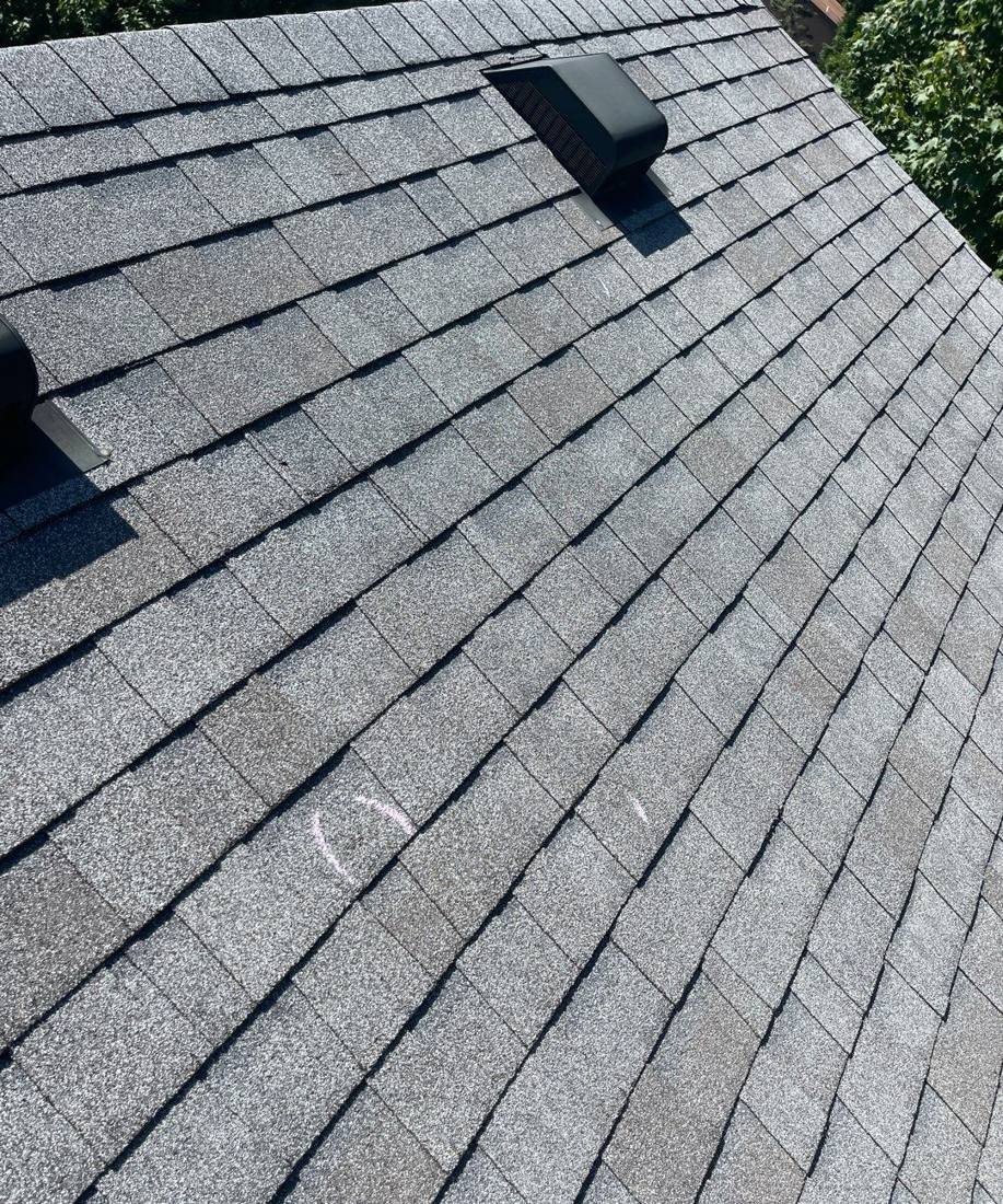 Chalk-marked hail hit on a Rosemount roof slope during an inspection, July 2022