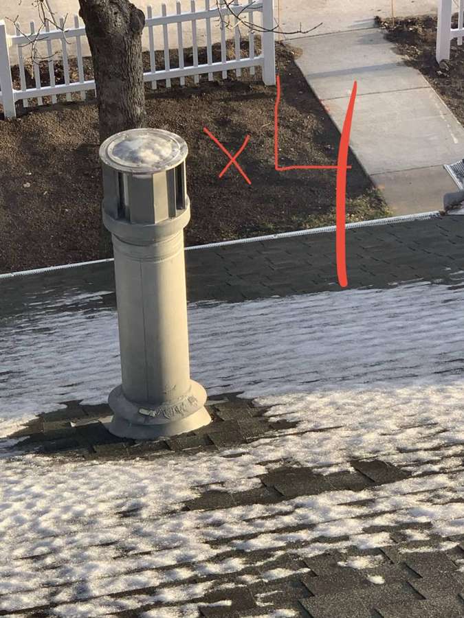 Roof vent with its count painted on the shingles beside it, on a Penn Place townhome roof in North St. Paul, MN