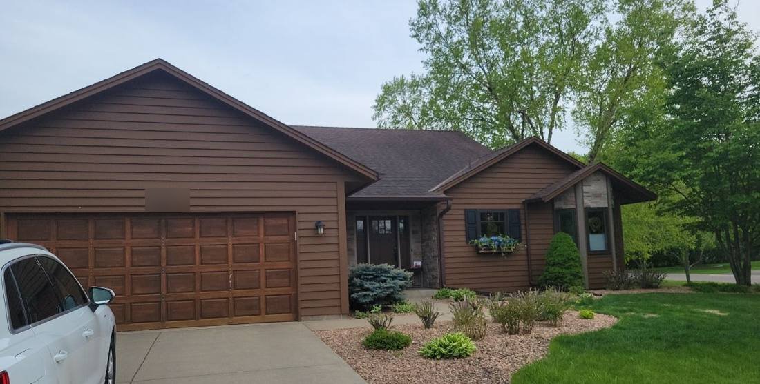 Home with brown lap siding in Lakeville during a roof inspection, May 2022