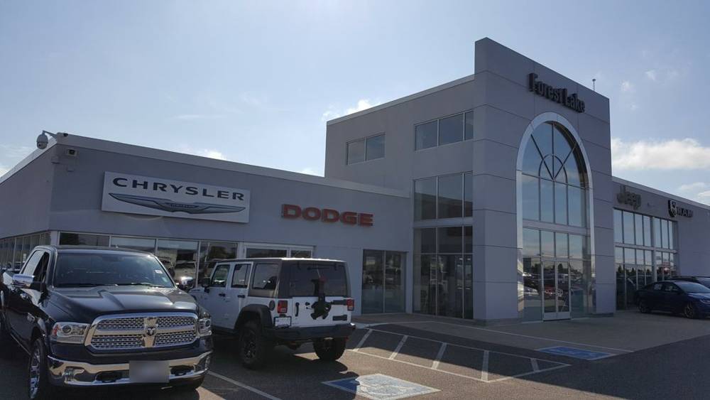 Forest Lake Chrysler Jeep Dodge showroom from the lot, the building under the Repair King Duro-Last roof