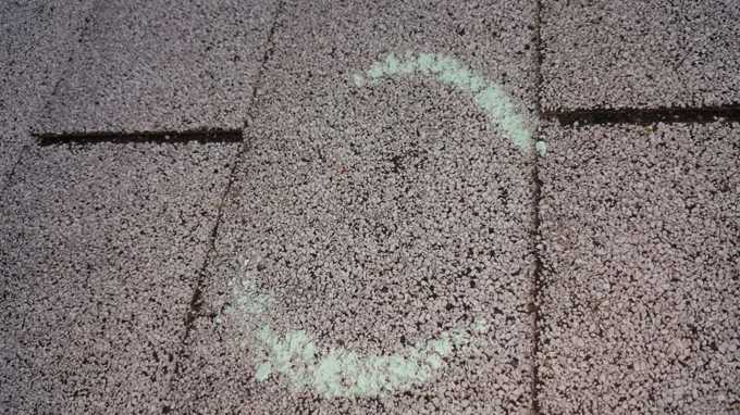Chalk-circled hail hit on a Red Rock Lodge roof during the winter inspection, Newport