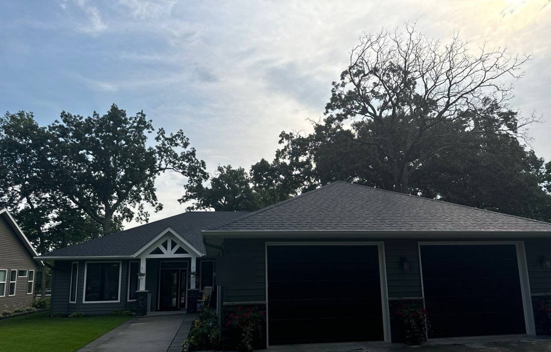 Ranch-style home near Clearwater photographed at dusk during a roof inspection, July 2024