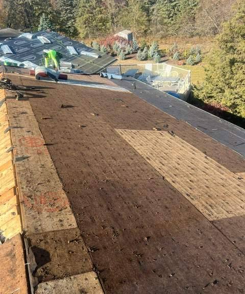 Bare roof deck during a tear-off on a Mendota Heights home, July 2023