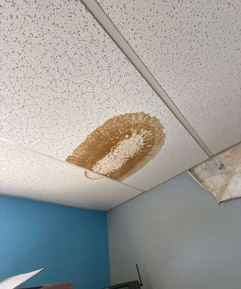Water stain on an interior ceiling tile, traced back to a roof leak at the Pine Bend Landfill office, October 2024