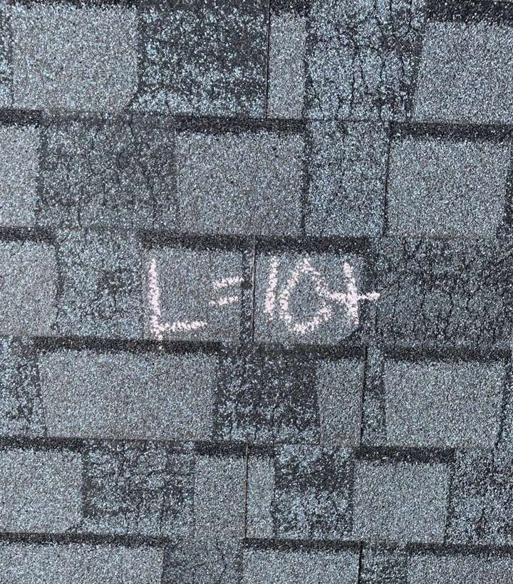 "L=10+" chalked on a Culver's shingle slope during the September 2021 hail inspection
