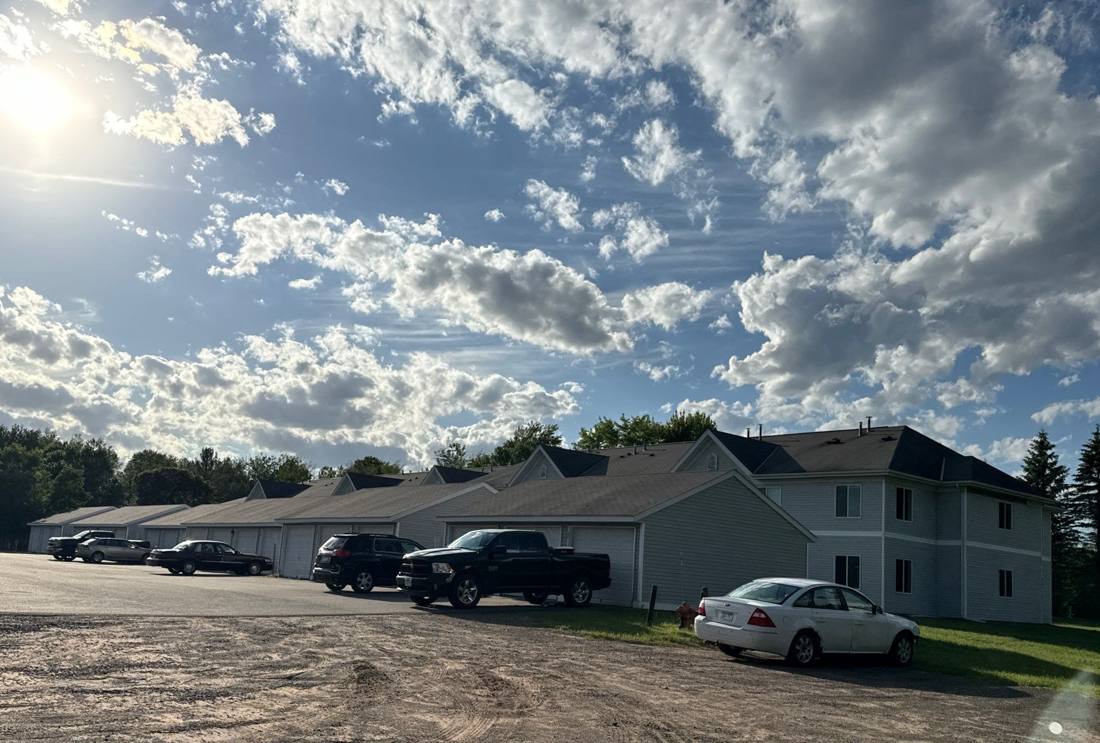Townhome building roofline at Wild River Townhomes in Sandstone, June 2024