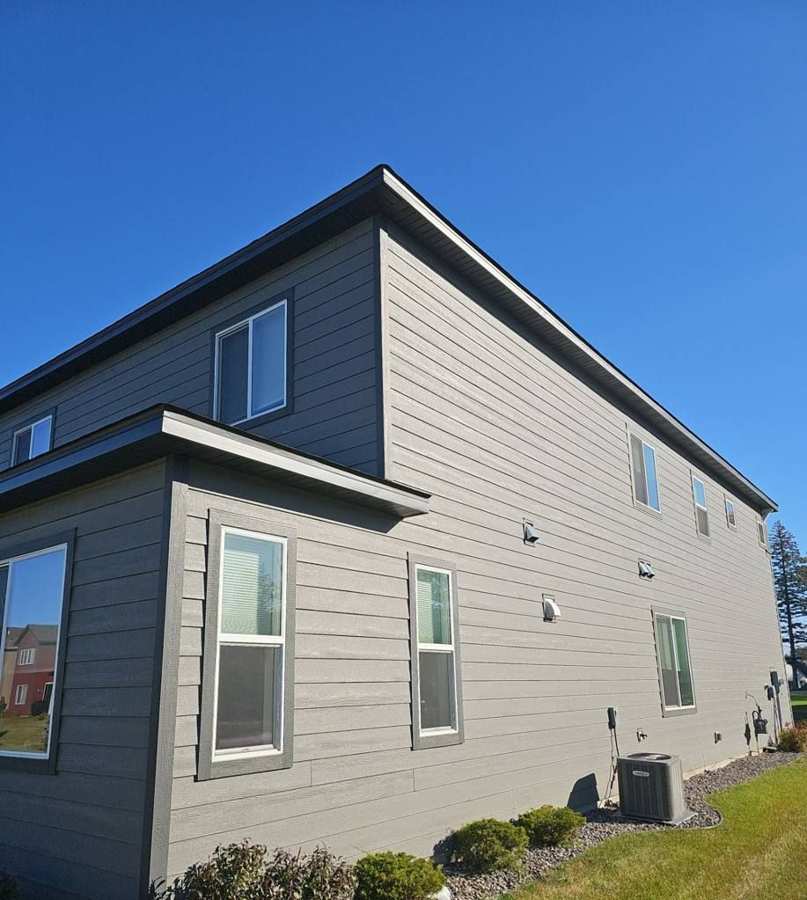 Gray-sided two-story home in Coon Rapids, MN photographed by Repair King in October 2024