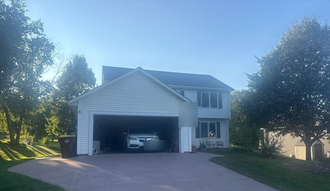 Two-story home in Lakeville photographed during a roof inspection, August 2025