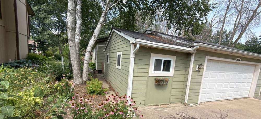 Two-story home in Chaska photographed during a roof project, July 2026