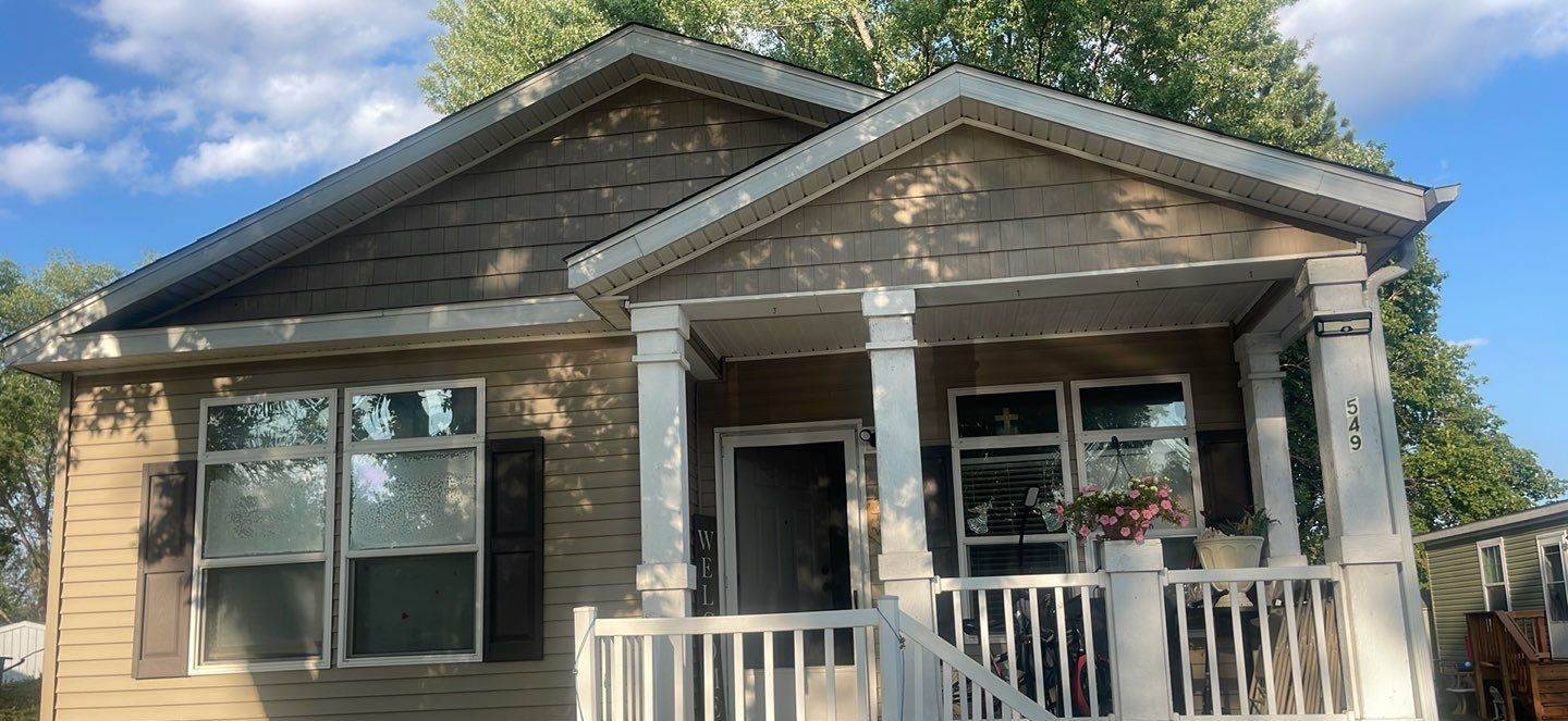 Manufactured home with a covered front porch in the Cimarron community in Lake Elmo, MN, photographed by Repair King during a July 2023 siding and hail inspection
