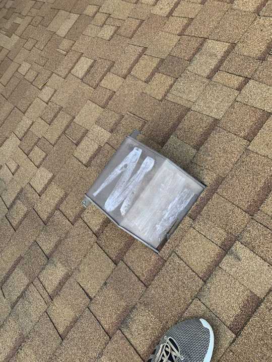 A box vent on the brown shingle roof of a Plymouth home, August 2019