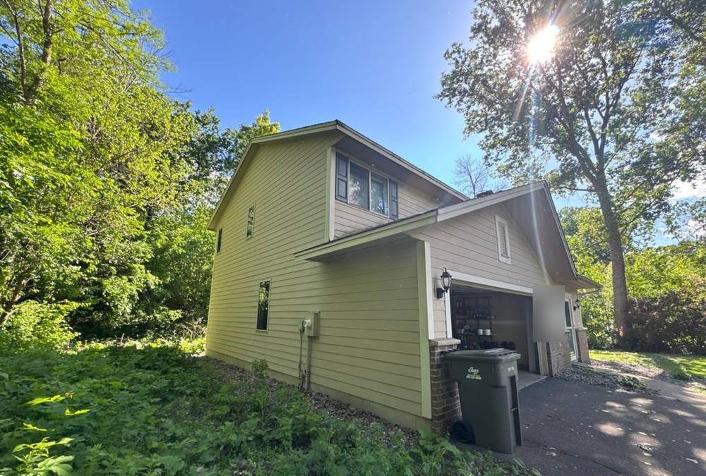 Two-story home near Jonathan Circle in Minnetonka, photographed during a roof project, June 2024