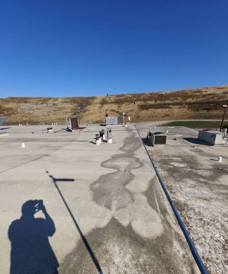 Wide view of the flat commercial roof at the Republic Services Pine Bend Landfill office in Inver Grove Heights, MN