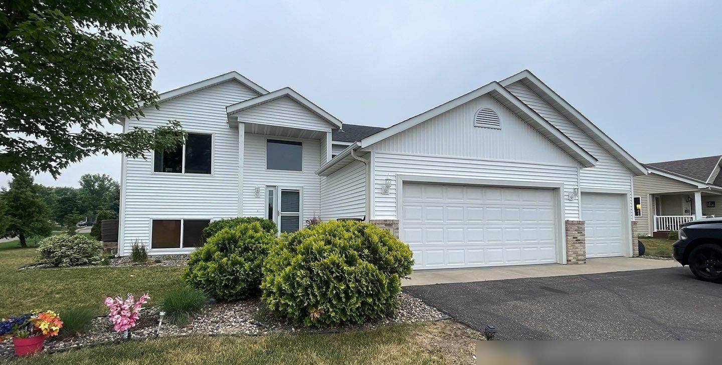 Two-story home in Sartell, MN photographed by Repair King during a June 2023 roof inspection