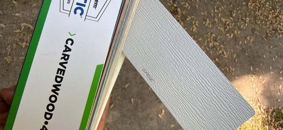 Mastic Carvedwood 44 siding sample for the Suzanne Avenue home in Shoreview, May 2026