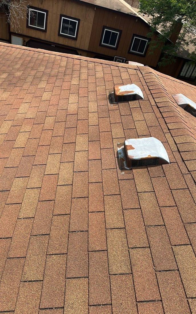 Roof vent caps on a Prior Lake building during an inspection, July 2023