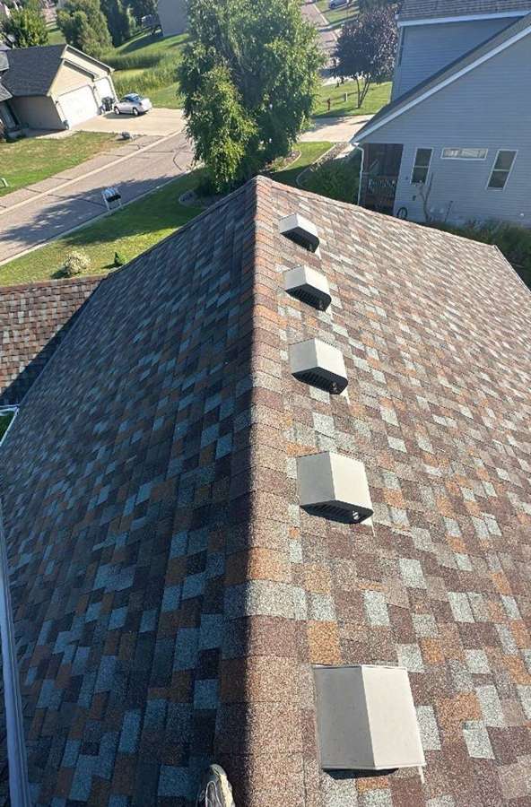 Shingle roof with a row of box vents on an Annandale home during a July 2023 Repair King inspection