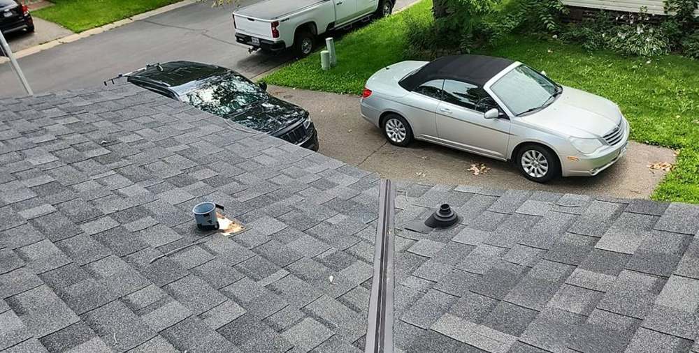 Aerial view of a Hastings driveway and roofline during an inspection, July 2023