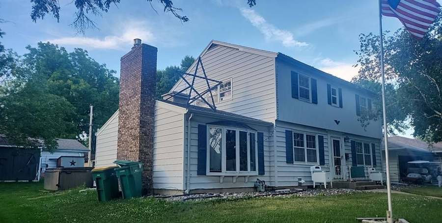 Two-story home on Fir Avenue NE in Montgomery photographed during a roof inspection, June 2023
