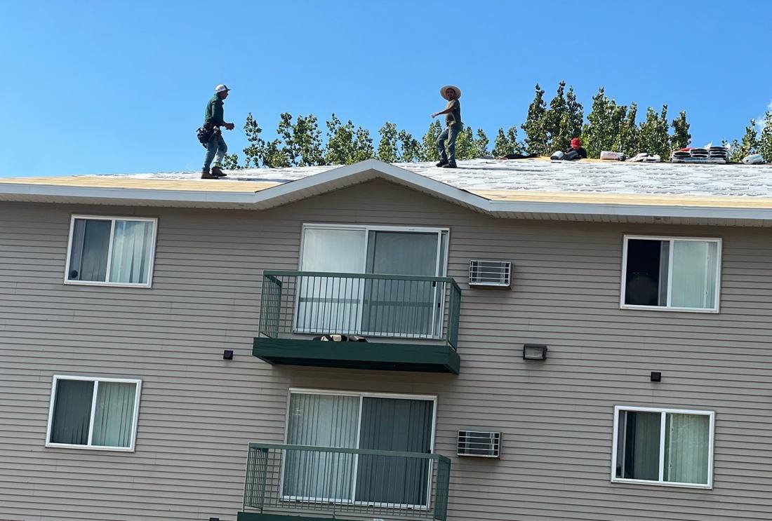 Repair King crew re-roofing a multi-unit apartment building in Oak Grove, September 2024