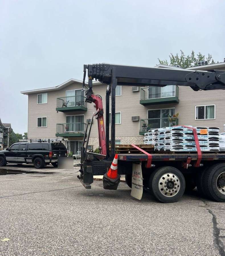 Shingles being delivered for Repair King's apartment re-roof in Hutchinson, August 2024