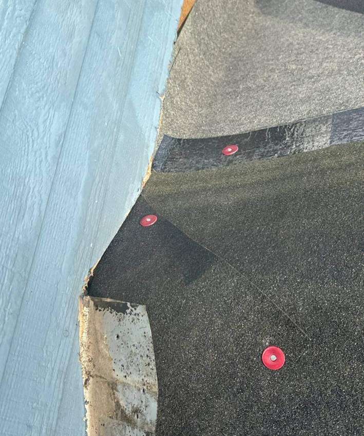 Roof valley and ice-and-water shield detail on a Burnsville tear-off, December 2023