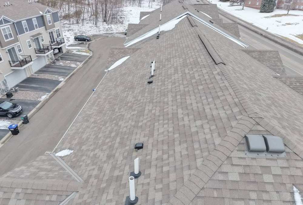 Aerial view of the Lexington Woods Townhomes roofs in Roseville during a Repair King roof project