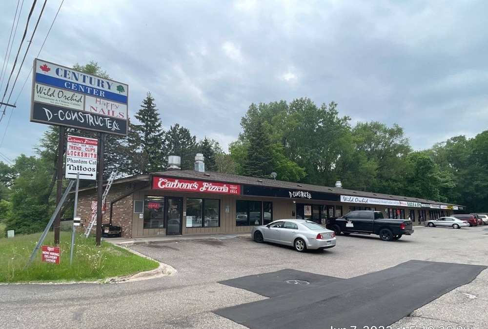 Century Center strip mall on Century Avenue North in Maplewood, home to Wild Orchid Restaurant and Happy Nails, photographed during a Repair King roof inspection