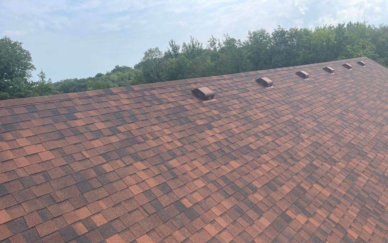 Aerial view of the asphalt shingle roof at Cascade United Methodist Church in Deerwood, MN