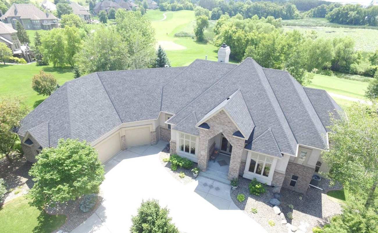 Aerial view of a Roseville, MN home's roof next to a golf course, photographed by Repair King, September 2025