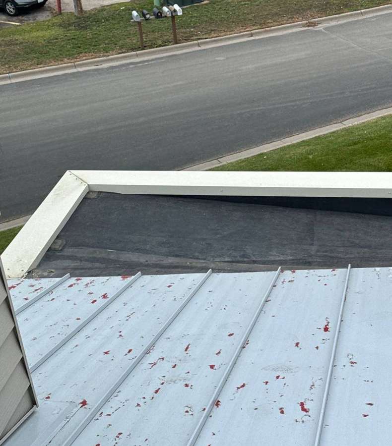 Chalk-marked hail damage on the metal roof edge of the Delano Dairy Queen on Highway 12, November 2023