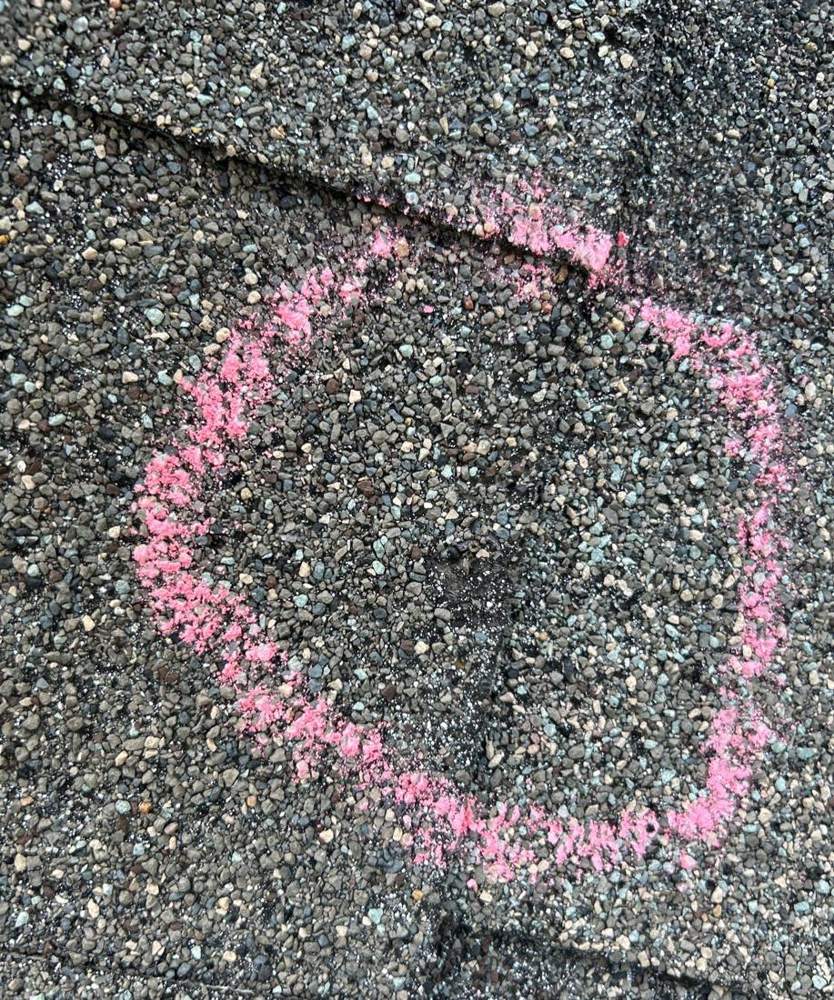 Hail hit chalk-marked on a Newport roof slope during an inspection, September 2025