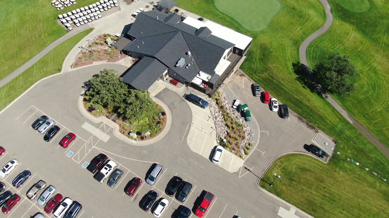 Aerial view of a multifamily apartment building in St. Cloud, MN during a Repair King re-roof, April 2024