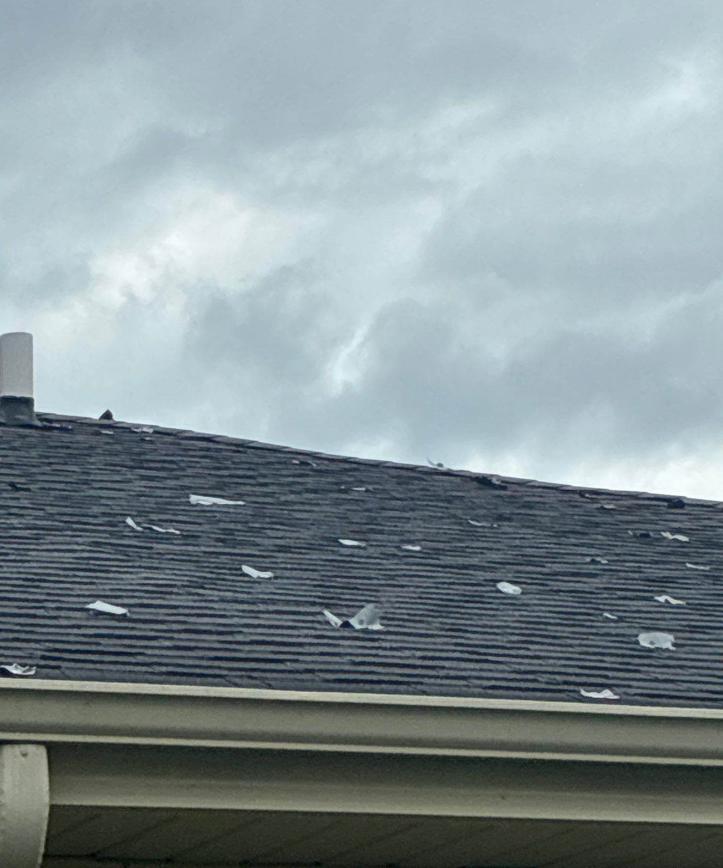 Wide view across a shingle roof toward a Darien, IL neighborhood, photographed during a Repair King roof inspection, April 2026