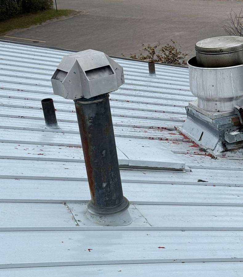 Chalk-marked hail hits around a roof vent at the Delano Dairy Queen, November 2023