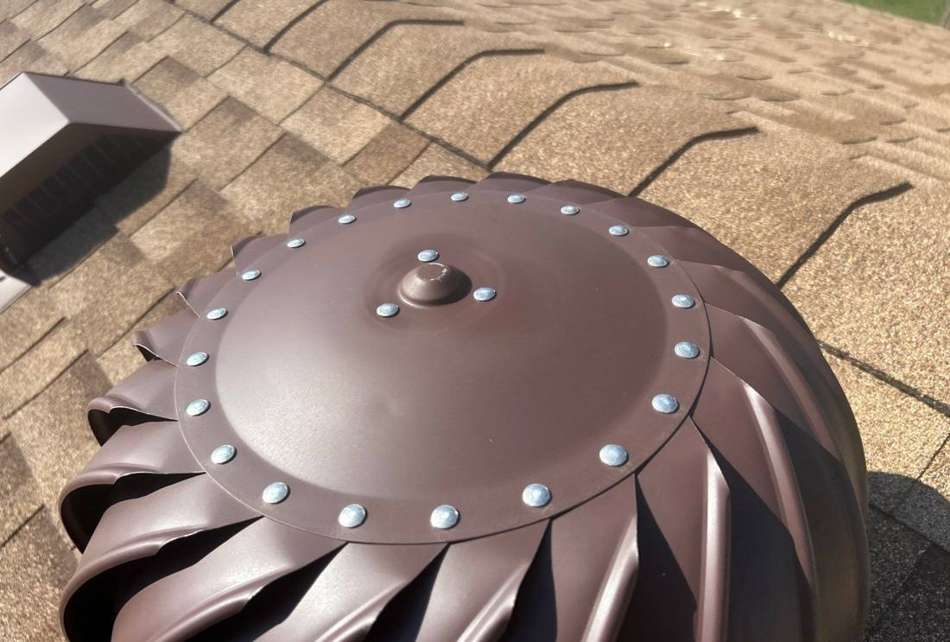 Turbine roof vent on the shingle roof at Job's House Of Prosperity in Inver Grove Heights, MN