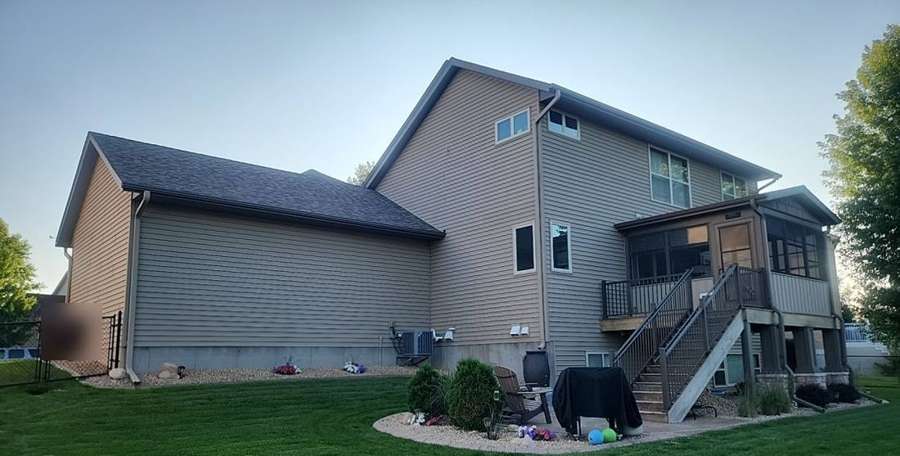 Rear of a two-story home off Dunes Avenue in Cottage Grove photographed during a July 2023 hail inspection