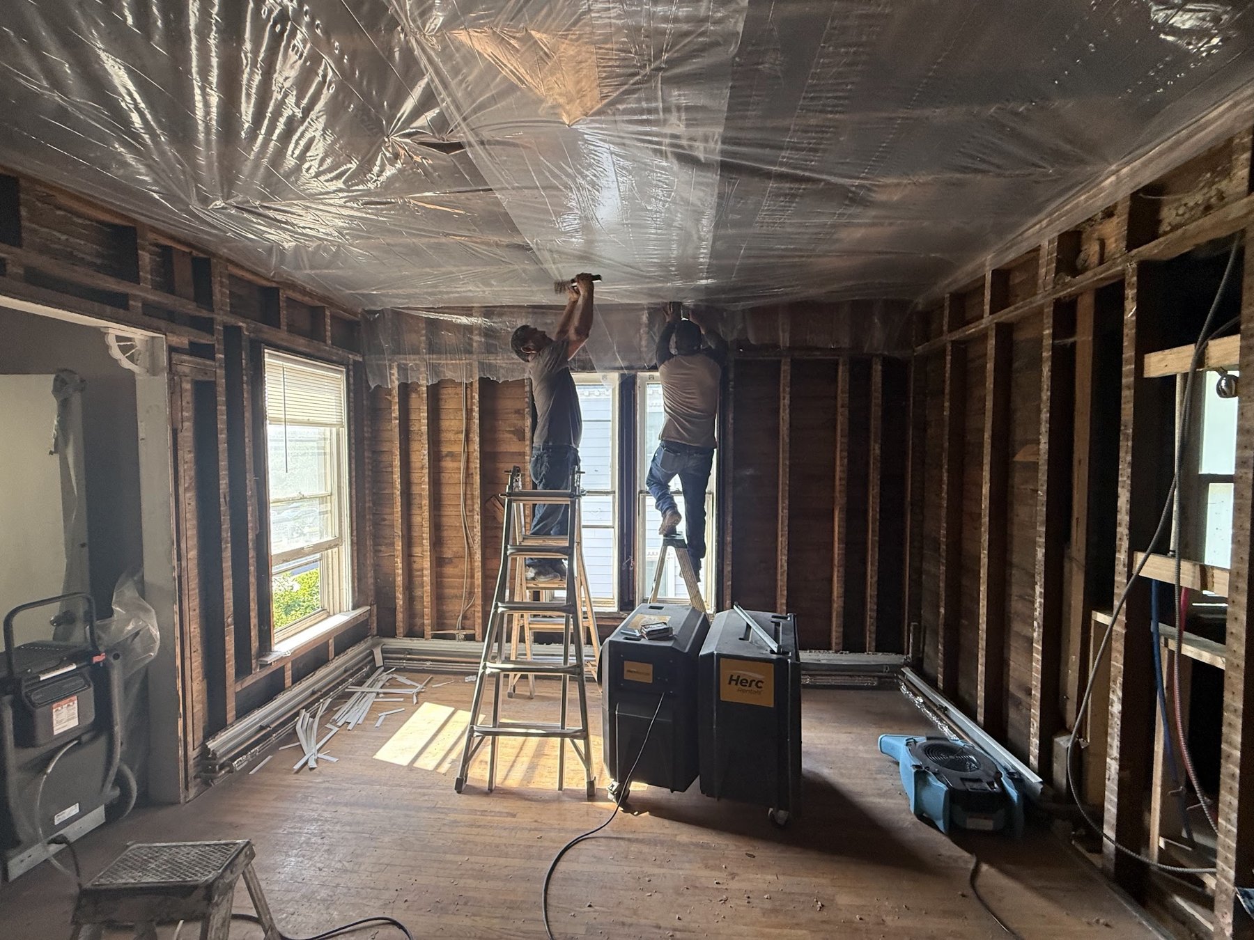 Repair King crew rebuilding the interior of a Twin Cities unit down to the studs