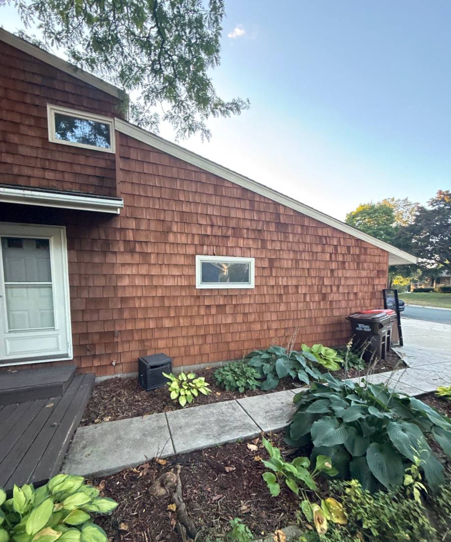 Cedar shake siding and dormer window on a South St. Paul home, September 2025