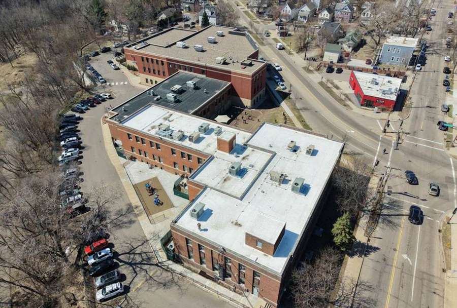 Drone view of HOPE Community Academy's white flat roofs and brick buildings on Payne Avenue in St. Paul, MN, April 2026